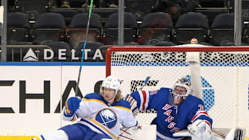 Mar 2, 2021; New York, New York, USA; Buffalo Sabres center Eric Staal (12) falls on New York Rangers goaltender Igor Shesterkin (31) during the second period at Madison Square Garden. Mandatory Credit: Bruce Bennett-POOL PHOTOS-USA TODAY Sports
