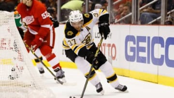 Oct 15, 2014; Detroit, MI, USA; Boston Bruins center Patrice Bergeron (37) skates with the puck against the Detroit Red Wings at Joe Louis Arena. Mandatory Credit: Rick Osentoski-USA TODAY Sports