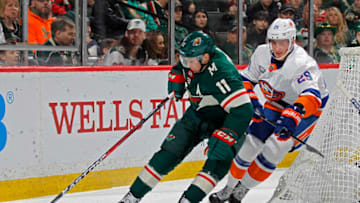 ST. PAUL, MN - MARCH 17: Zach Parise #11 of the Minnesota Wild protects the puck from Brock Nelson #29 of the New York Islanders during a game at Xcel Energy Center on March 17, 2019 in St. Paul, Minnesota.(Photo by Bruce Kluckhohn/NHLI via Getty Images)