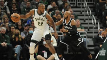 Oct 19, 2021; Milwaukee, Wisconsin, USA; Milwaukee Bucks forward Khris Middleton (22) is guarded by Brooklyn Nets guard Jevon Carter (0) in the first half at Fiserv Forum. Mandatory Credit: Michael McLoone-USA TODAY Sports