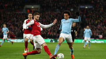 LONDON, ENGLAND - FEBRUARY 25: Calum Chambers of Arsenal tackles Leroy Sane of Manchester City during the Carabao Cup Final between Arsenal and Manchester City at Wembley Stadium on February 25, 2018 in London, England. (Photo by Catherine Ivill/Getty Images)