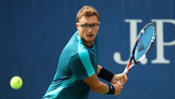 NEW YORK, NY - AUGUST 28: Denis Istomin of Uzbekistan returns a shot during his first round Men's Singles match against Albert Ramos Viñolas of Spain on Day One of the 2017 US Open at the USTA Billie Jean King National Tennis Center on August 28, 2017 in the Flushing neighborhood of the Queens borough of New York City. (Photo by Clive Brunskill/Getty Images)