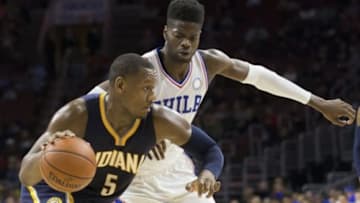 Nov 18, 2015; Philadelphia, PA, USA; Indiana Pacers forward Lavoy Allen (5) drives past Philadelphia 76ers forward Nerlens Noel (4) during the second half at Wells Fargo Center. The Pacers won 112-85. Mandatory Credit: Bill Streicher-USA TODAY Sports