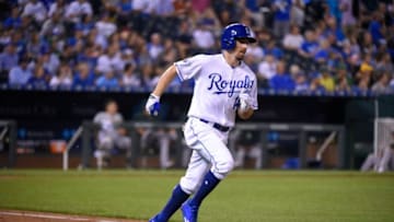 KANSAS CITY, MO - SEPTEMBER 15: Billy Burns #14 of the Kansas City Royals runs to first after hitting against the Oakland Athletics at Kauffman Stadium on September 15, 2016 in Kansas City, Missouri. (Photo by Ed Zurga/Getty Images)
