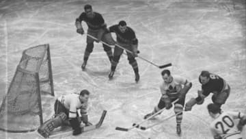 (Original Caption) Here is a fast bit of action from a Stanley Cup Hockey game between the New York Rangers and Toronto Maple Leafs at Madison Square Garden on April 2nd. Lester Patrick, (9) of the Rangers leads the attack on the Leaf's net. Stanowski, (20) of the Leafs and another Toronto man rally to goalie Broda's aid--but there was no score on this play.