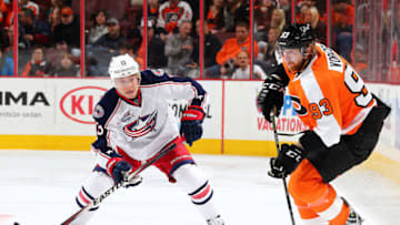 PHILADELPHIA, PA - NOVEMBER 22: Jakub Voracek #93 of the Philadelphia Flyers takes the puck as Cam Atkinson #13 of the Columbus Blue Jackets defends on November 22, 2014 at the Wells Fargo Center in Philadelphia, Pennsylvania. (Photo by Elsa/Getty Images)