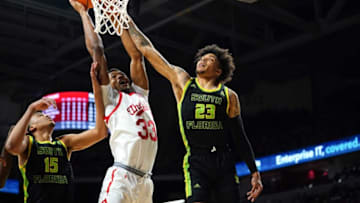 Cincinnati Bearcats forward Ody Oguama rises to the basket against South Florida Bulls at Fifth Third Arena. The Enquirer.