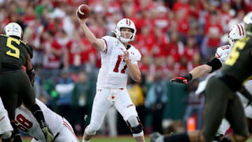 PASADENA, CALIFORNIA - JANUARY 01: Jack Coan #17 of the Wisconsin Badgers throws a pass against the Oregon Ducks during the first half in the Rose Bowl game presented by Northwestern Mutual at Rose Bowl on January 01, 2020 in Pasadena, California. (Photo by Sean M. Haffey/Getty Images)