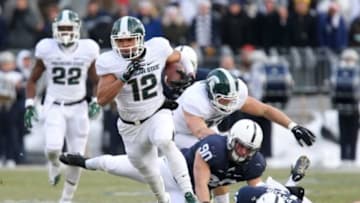 Nov 29, 2014; University Park, PA, USA; Michigan State Spartans wide receiver R.J. Shelton (12) runs with the ball during the first quarter against the Penn State Nittany Lions at Beaver Stadium. Mandatory Credit: Matthew O