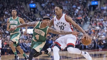 Mar 18, 2016; Toronto, Ontario, CAN; Boston Celtics guard Isaiah Thomas (4) defends as Toronto Raptors guard DeMar DeRozan (10) dribbles toward the net in the first quarter at Air Canada Centre. Mandatory Credit: Peter Llewellyn-USA TODAY Sports