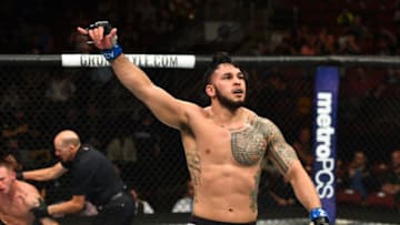 GLENDALE, AZ - APRIL 14: (R-L) Brad Tavares celebrates his victory over Krzysztof Jotko of Poland in their middleweight fight during the UFC Fight Night event at the Gila Rivera Arena on April 14, 2018 in Glendale, Arizona. (Photo by Josh Hedges/Zuffa LLC/Zuffa LLC via Getty Images)