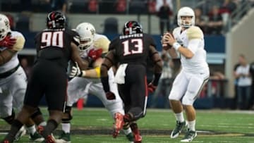 Nov 29, 2014; Arlington, TX, USA; Baylor Bears quarterback Bryce Petty (14) drops back to pass against the Texas Tech Red Raiders during the first quarter at AT&T Stadium. Mandatory Credit: Jerome Miron-USA TODAY Sports