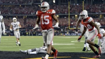 uJan 12, 2015; Arlington, TX, USA; Ohio State Buckeyes running back Ezekiel Elliott (15) celebrates scoring a touchdown against the Oregon Ducks during the third quarter in the 2015 CFP National Championship Game at AT&T Stadium. Mandatory Credit: Tommy Gilligan-USA TODAY Sports