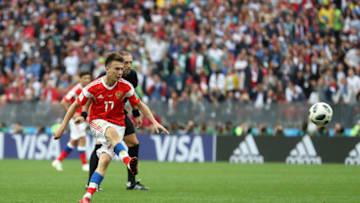 MOSCOW, RUSSIA - JUNE 14: Aleksandr Golovin of Russia scores his sides fifth goal from a free kick during the 2018 FIFA World Cup Russia Group A match between Russia and Saudi Arabia at Luzhniki Stadium on June 14, 2018 in Moscow, Russia. (Photo by Catherine Ivill/Getty Images)
