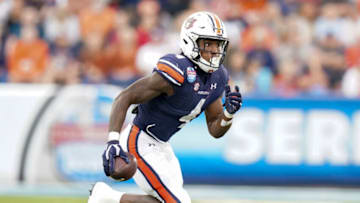 Auburn footballDec 28, 2021; Birmingham, Alabama, USA; Auburn Tigers running back Tank Bigsby (4) carries the ball against Houston Cougars during the second half of the 2021 Birmingham Bowl at Protective Stadium. Mandatory Credit: Marvin Gentry-USA TODAY Sports