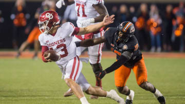 Auburn footballNov 27, 2021; Stillwater, Oklahoma, USA; Oklahoma State Cowboys linebacker Devin Harper (16) sacks Oklahoma Sooners quarterback Caleb Williams (13) during the fourth quarter at Boone Pickens Stadium. Oklahoma State won 37-33. Mandatory Credit: Brett Rojo-USA TODAY Sports