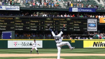 SEATTLE, WA - AUGUST 15: Starting pitcher Felix Hernandez #34 of the Seattle Mariners and shortstop Brendan Ryan #26 celebrate after Hernandez threw the 23rd perfect game in Major League Baseball history to defeat the Tampa Bay Rays 1-0 at Safeco Field on August 15, 2012 in Seattle, Washington. (Photo by Otto Greule Jr/Getty Images)