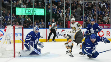 Nov 8, 2022; Toronto, Ontario, CAN; Toronto Maple Leafs defenseman Morgan Rielly (44) battles in front of the net with Vegas Golden Knights left wing William Carrier (28 during the second period at Scotiabank Arena. Mandatory Credit: Nick Turchiaro-USA TODAY Sports