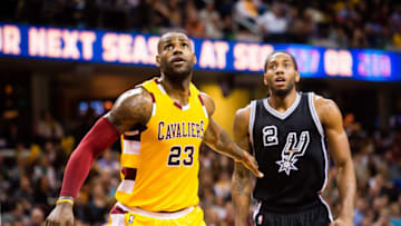 CLEVELAND, OH - JANUARY 30: LeBron James #23 of the Cleveland Cavaliers and Kawhi Leonard #2 of the San Antonio Spurs wait for a rebound during the second half at Quicken Loans Arena on January 30, 2016 in Cleveland, Ohio. The Cavaliers defeated the Spurs 117-103. NOTE TO USER: User expressly acknowledges and agrees that, by downloading and/or using this photograph, user is consenting to the terms and conditions of the Getty Images License Agreement. Mandatory copyright notice. (Photo by Jason Miller/Getty Images)