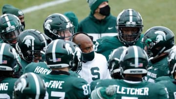 Michigan State head coach Mel Tucker talks to players during a timeout during the first half against Ohio State at the Spartan Stadium in East Lansing on Saturday, Dec. 5, 2020.