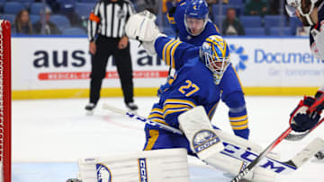 Sep 30, 2023; Buffalo, New York, USA; Buffalo Sabres goaltender Devon Levi (27) makes a pad save during the third period against the Columbus Blue Jackets at KeyBank Center. Mandatory Credit: Timothy T. Ludwig-USA TODAY Sports