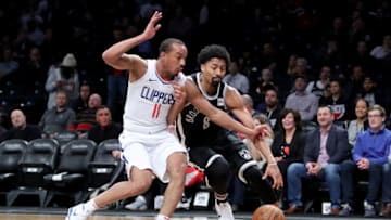 NEW YORK, NY - FEBRUARY 12: Avery Bradley #11 of the LA Clippers defends against Spencer Dinwiddie #8 of the Brooklyn Nets in the first quarter during their game at Barclays Center on February 12, 2018 in the Brooklyn borough of New York City. NOTE TO USER: User expressly acknowledges and agrees that, by downloading and or using this photograph, User is consenting to the terms and conditions of the Getty Images License Agreement. (Photo by Abbie Parr/Getty Images)