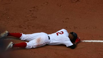 BOSTON, MA - JUNE 10: Xander Bogaerts #2 of the Boston Red Sox gets thrown out at first base and lands on the ground after the play in the bottom of the fifth inning of the game against the Chicago White Sox at Fenway Park on June 10, 2018 in Boston, Massachusetts. (Photo by Omar Rawlings/Getty Images)