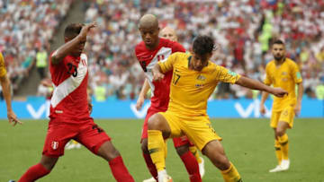 SOCHI, RUSSIA - JUNE 26: Daniel Arzani of Australia under pressure from Pedro Aquino and Andre Carrillo of Peru during the 2018 FIFA World Cup Russia group C match between Australia and Peru at Fisht Stadium on June 26, 2018 in Sochi, Russia. (Photo by Robert Cianflone/Getty Images)