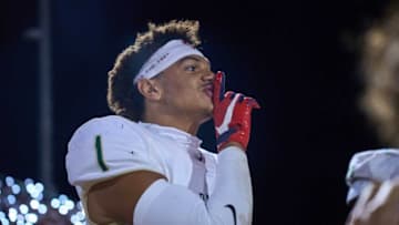 Oct 28, 2022; Chandler, AZ, USA; While looking toward the Chandler Wolves sideline, Basha Bears cornerback Miles Lockhart (1) holds up the “shush” sign at Austin Field in Chandler on Friday, Oct. 28, 2022. Mandatory Credit: Alex Gould/The RepublicHigh School Football Chandler Football Game Basha At Chandler