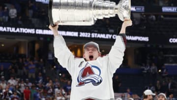TAMPA, FLORIDA - JUNE 26: Bowen Byram #4 of the Colorado Avalanche lifts the Stanley Cup after defeating the Tampa Bay Lightning 2-1 in Game Six of the 2022 NHL Stanley Cup Final at Amalie Arena on June 26, 2022 in Tampa, Florida. (Photo by Christian Petersen/Getty Images)
