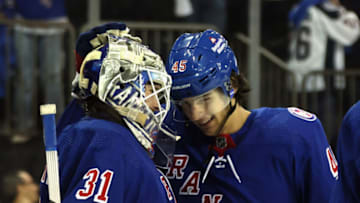 NEW YORK, NEW YORK - MAY 28: Igor Shesterkin #31 and Braden Schneider #45 of the New York Rangers celebrate their 5-2 victory over the Carolina Hurricanes in Game Six of the Second Round of the 2022 Stanley Cup Playoffs at Madison Square Garden on May 28, 2022 in New York City. (Photo by Bruce Bennett/Getty Images)