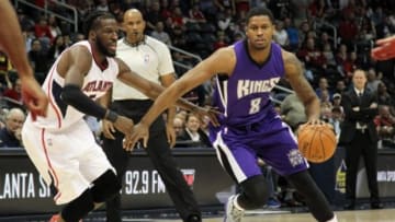 Mar 9, 2015; Atlanta, GA, USA; Sacramento Kings forward Rudy Gay (8) drives past Atlanta Hawks forward DeMarre Carroll (5) in the first quarter at Philips Arena. Mandatory Credit: Brett Davis-USA TODAY Sports