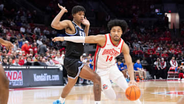 Nov 16, 2022; Columbus, Ohio, USA; Ohio State Buckeyes forward Justice Sueing (14) drives past Eastern Illinois Panthers forward Sincere Malone (5) in the second half at Value City Arena. Mandatory Credit: Greg Bartram-USA TODAY Sports