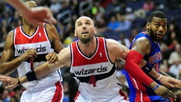 Jan 18, 2014; Washington, DC, USA; Washington Wizards center Marcin Gortat (4) fights for a loose ball with Detroit Pistons forward Greg Monroe (10) at Verizon Center. Mandatory Credit: Evan Habeeb-USA TODAY Sports