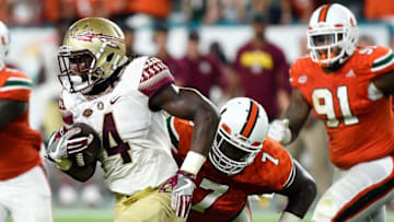 Oct 8, 2016; Miami Gardens, FL, USA; Florida State Seminoles running back Dalvin Cook (4) carries the ball during the first half against Miami Hurricanes at Hard Rock Stadium. Mandatory Credit: Steve Mitchell-USA TODAY Sports