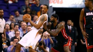 Feb 11, 2014; Phoenix, AZ, USA; Phoenix Suns center Channing Frye (left) against Miami Heat forward LeBron James at the US Airways Center. The Heat defeated the Suns 103-97. Mandatory Credit: Mark J. Rebilas-USA TODAY Sports