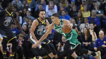 OAKLAND, CA - JANUARY 27: Jayson Tatum #0 of the Boston Celtics drives towards the basket on Stephen Curry #30 of the Golden State Warriors during an NBA basketball game at ORACLE Arena on January 27, 2018 in Oakland, California. NOTE TO USER: User expressly acknowledges and agrees that, by downloading and or using this photograph, User is consenting to the terms and conditions of the Getty Images License Agreement. (Photo by Thearon W. Henderson/Getty Images)