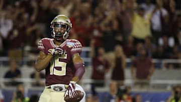Sep 5, 2016; Orlando, FL, USA; Florida State Seminoles wide receiver Travis Rudolph (15) catches the ball and runs it in for a touchdown against the Mississippi Rebels during the first half at Camping World Stadium. Mandatory Credit: Kim Klement-USA TODAY Sports