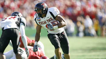 Joel Filani of Texas Tech runs with a reception during the 4th quarter against Alabama at the AT&T Cotton Bowl in Dallas, Texas on January 2, 2006. Alabama won 13-10. (Photo by G. N. Lowrance/Getty Images)