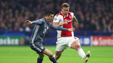 AMSTERDAM, NETHERLANDS - DECEMBER 12: Robert Lewandowski of Bayern Muenchen battles for the ball with Matthijs de Ligt of Ajax during the UEFA Champions League Group E match between Ajax and FC Bayern Munich at Johan Cruyff Arena on December 12, 2018 in Amsterdam, Netherlands. (Photo by Dean Mouhtaropoulos/Getty Images)