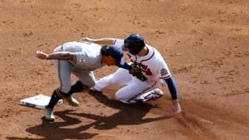 Adam Duvall, Atlanta Braves, Kolten Wong, Milwaukee Brewers. (Photo by Michael Zarrilli/Getty Images)