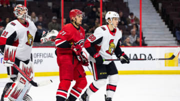 OTTAWA, ON - FEBRUARY 12: Carolina Hurricanes Left Wing Nino Niederreiter (21) sets up between Ottawa Senators Goalie Anders Nilsson (31) and Ottawa Senators Defenceman Maxime Lajoie (58) during third period National Hockey League action between the Carolina Hurricanes and Ottawa Senators on February 12, 2019, at Canadian Tire Centre in Ottawa, ON, Canada. (Photo by Richard A. Whittaker/Icon Sportswire via Getty Images)