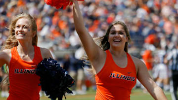 Sep 11, 2021; Charlottesville, Virginia, USA; Illinois Fighting Illini cheerleaders run onto the field after a touchdown against the Virginia Cavaliers at Scott Stadium. Mandatory Credit: Geoff Burke-USA TODAY Sports