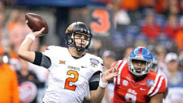 Jan 1, 2016; New Orleans, LA, USA; Oklahoma State Cowboys quarterback Mason Rudolph (2) makes a throw against the Mississippi Rebels in the second quarter of the 2016 Sugar Bowl at the Mercedes-Benz Superdome. Mandatory Credit: Chuck Cook-USA TODAY Sports