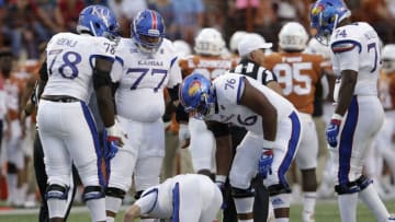 AUSTIN, TX - NOVEMBER 11: Carter Stanley #9 of the Kansas Jayhawks is injured on a play in the first quarter against the Texas Longhorns at Darrell K Royal-Texas Memorial Stadium on November 11, 2017 in Austin, Texas. (Photo by Tim Warner/Getty Images)