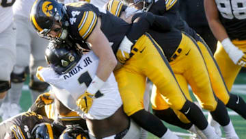 IOWA CITY, IOWA- NOVEMBER 18: Running back D.J. Knox #1 of the Purdue Boilermakers is brought down in the second quarter by linebacker Ben Niemann #44 of the Iowa Hawkeyes, on November 18, 2017 at Kinnick Stadium in Iowa City, Iowa. (Photo by Matthew Holst/Getty Images)