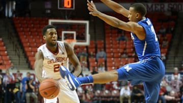 Dec 17, 2016; Norman, OK, USA; Oklahoma Sooners forward Dante Buford (21) passes the ball around Memphis Tigers guard Jimario Rivers (2) during the second half at Lloyd Noble Center. Mandatory Credit: Mark D. Smith-USA TODAY Sports