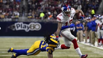 Dec 21, 2014; St. Louis, MO, USA; St. Louis Rams cornerback Janoris Jenkins (21) attempts to tackle New York Giants wide receiver Odell Beckham (13) during the first half at the Edward Jones Dome. Mandatory Credit: Jasen Vinlove-USA TODAY Sports