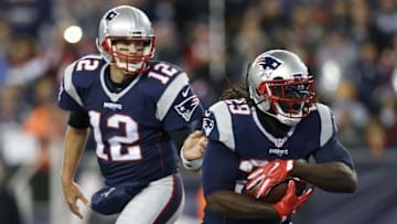 Nov 13, 2016; Foxborough, MA, USA; New England Patriots quarterback Tom Brady (12) hands the ball off to running back LeGarrette Blount (29) during the second quarter against the Seattle Seahawks at Gillette Stadium. Mandatory Credit: Greg M. Cooper-USA TODAY Sports