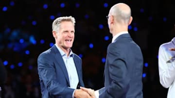OAKLAND, CA - OCTOBER 17: Head coach Steve Kerr of the Golden State Warriors shakes hands NBA commissioner Adam Silver during their 2017 NBA Championship ring ceremony prior to their NBA game against the Houston Rockets at ORACLE Arena on October 17, 2017 in Oakland, California. NOTE TO USER: User expressly acknowledges and agrees that, by downloading and or using this photograph, User is consenting to the terms and conditions of the Getty Images License Agreement. (Photo by Ezra Shaw/Getty Images)